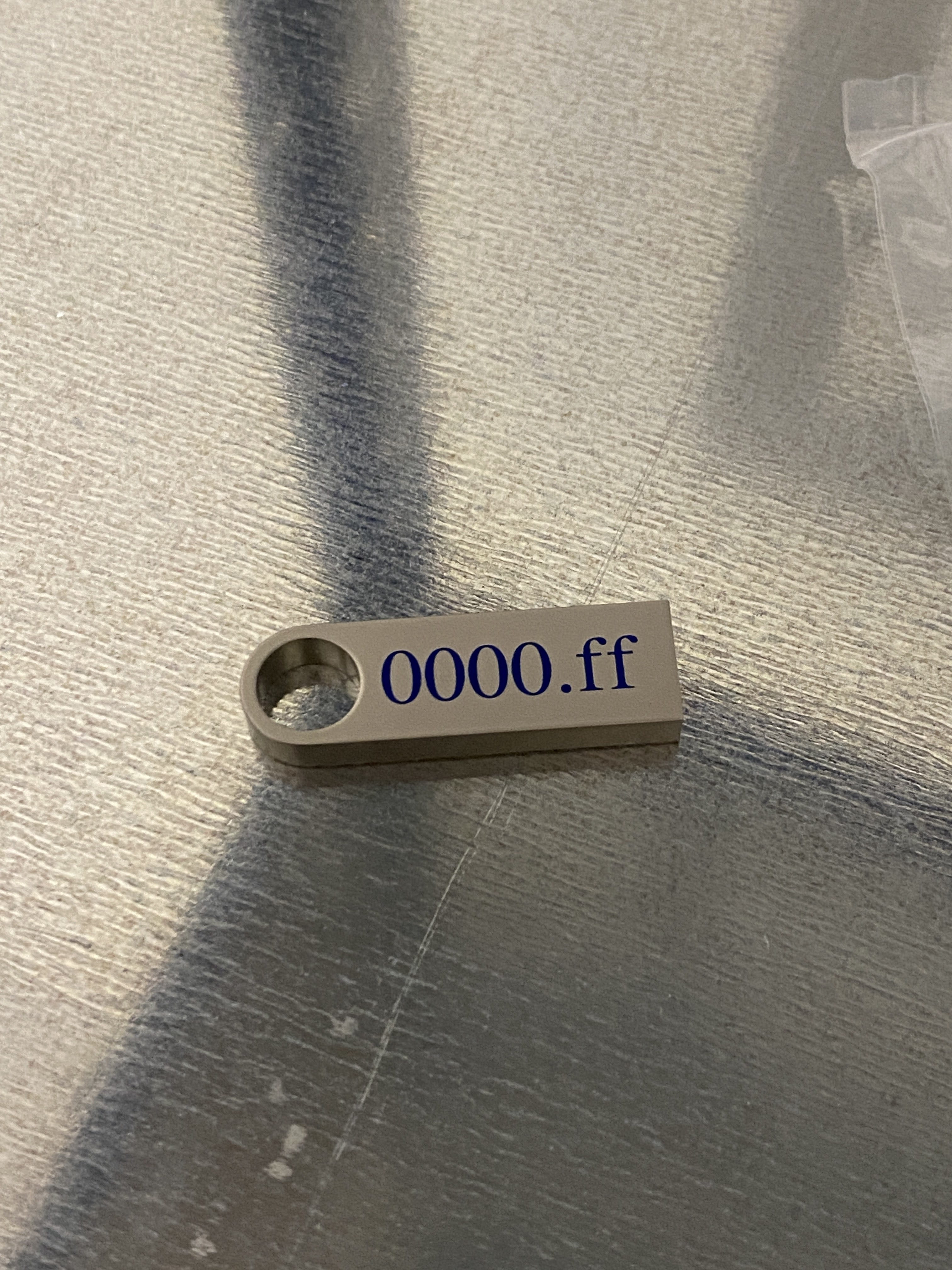 USB drive labeled 0000.ff closeup view