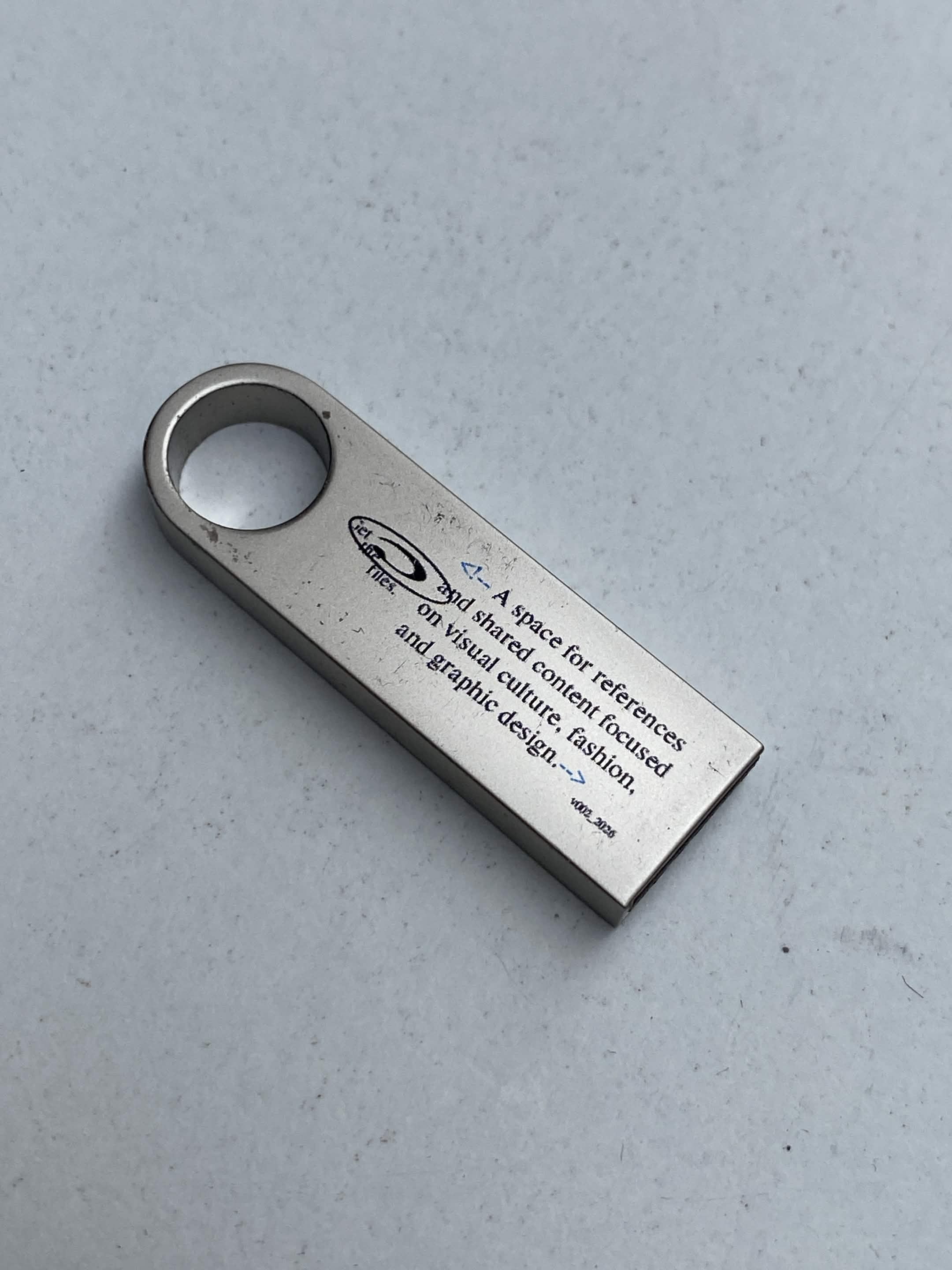USB drive labeled 0000ff.website